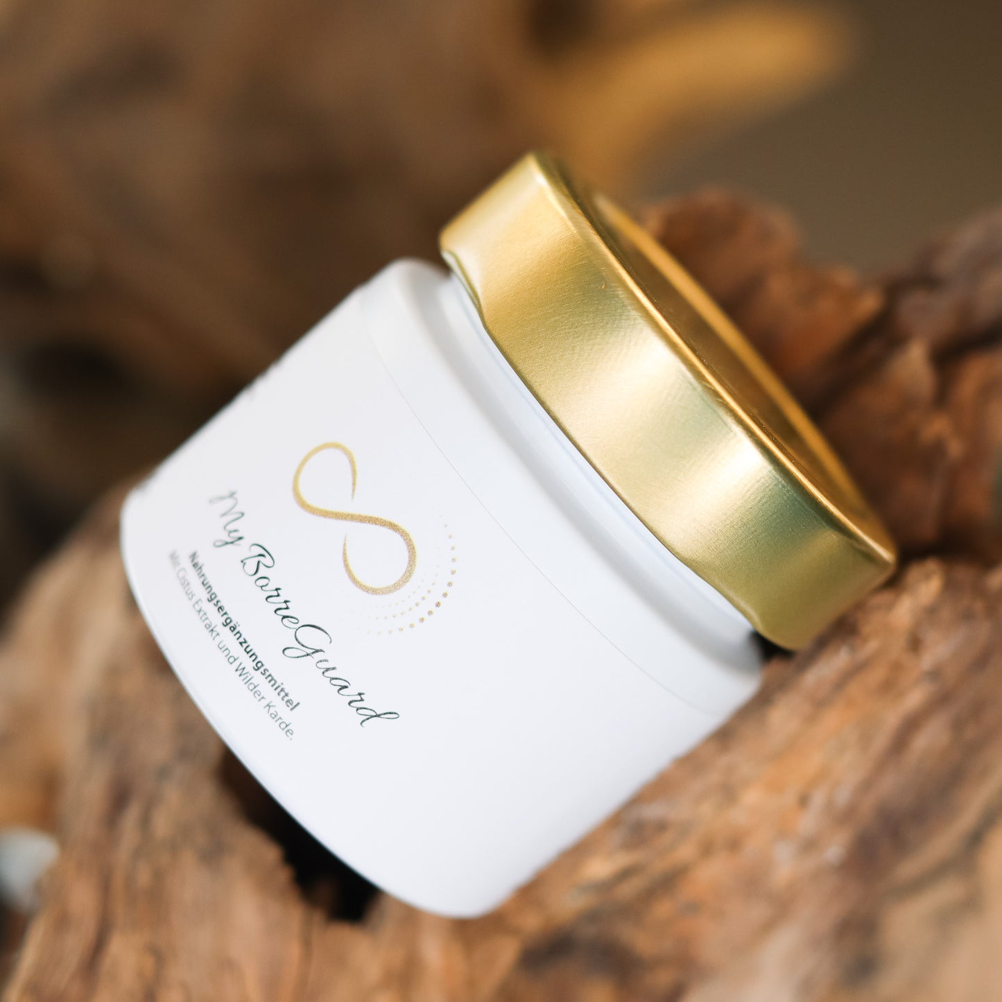 Produktbild eines Nahrungsergänzungsmittels im weißen Glas mit goldenem Deckel, liegend auf natürlichem Holzuntergrund. Abgebildet ist das Produkt „My BorreGuard“ aus der ANS Nutrivity Secrets Serie – hochwertiges Supplement, fotografiert zur Veranschaulichung der Verpackung. Die genaue Zusammensetzung und Anwendungshinweise sind der Produktbeschreibung im Shop zu entnehmen.