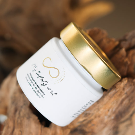 Produktbild eines Nahrungsergänzungsmittels im weißen Glas mit goldenem Deckel, liegend auf natürlichem Holzuntergrund. Abgebildet ist das Produkt „My InflaGuard“ aus der ANS Nutrivity Secrets Serie – hochwertiges Supplement, fotografiert zur Veranschaulichung der Verpackung. Die genaue Zusammensetzung und Anwendungshinweise sind der Produktbeschreibung im Shop zu entnehmen.