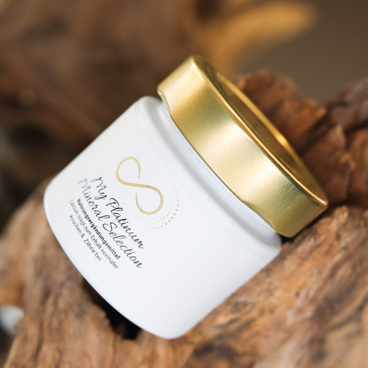 Produktbild eines Nahrungsergänzungsmittels im weißen Glas mit goldenem Deckel, liegend auf natürlichem Holzuntergrund. Abgebildet ist das Produkt „My Platinum Mineral Selection“ aus der ANS Nutrivity Secrets Serie – hochwertiges Supplement, fotografiert zur Veranschaulichung der Verpackung. Die genaue Zusammensetzung und Anwendungshinweise sind der Produktbeschreibung im Shop zu entnehmen.